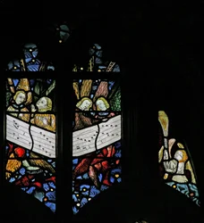 Window depicting the angelic choir singing; angel censing