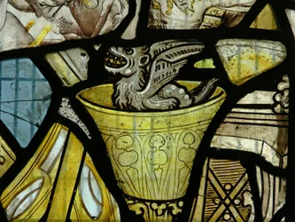 Window depicting a devil in a chalice - probably from a panel of St John