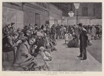 Hop pickers waiting outside London Bridge Station for the midnight train to Kent