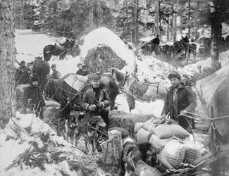 Prospectors ascending Porcupine Hill on the Skagway Trail, Alaska, during the Klondike Gold Rush (1897-98), 1898