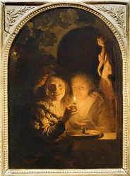 Couple illuminated by a candle
