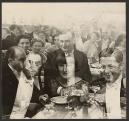 Double Exposure of a Group of People at a Banquet