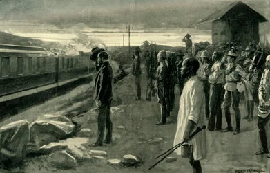 The Train Conveying the Remains of Mr. Rhodes Saluted by the Blockhouse Guards