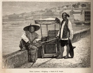 Two Bearers at Rest Beside Their Wheelchair in Hong Kong