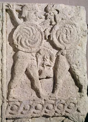 Detail of a tombstone with two warriors