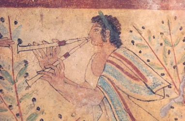 Etruscan art: a flute player (detail)