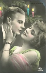 Couple About to Kiss in Front of Christmas Tree