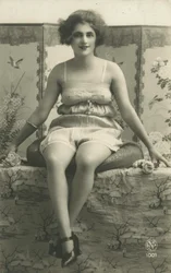 Portrait of a seated woman in her underwear