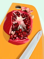 Cut Pomegranate and Knife on Cutting Board