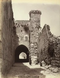 The Antonia Tower in Jerusalem. Some Men are Resting Near the Walls