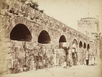 View of the City Walls of Heliopolis or Baalbek, Ancient Syrian City, Now Lebanon. A Group of People are Gathered Together Close to the Wall
