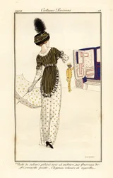 Woman in waistcoat of pekine velvet over a printed sheath dress