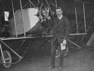 One of the Best Instructors: Lewis W.F. Turner Standing by a Caudron Training Biplane