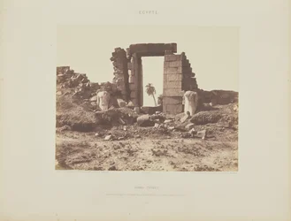 Karnak (Thebes). First Pylon - Ruins of the Gate and Colossi, viewed from Point E