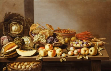 Bowls of Fruit and Nuts on a wooden table with a Basket of Pears beneath