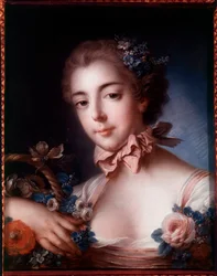 Portrait of a young woman leaning on a basket of flowers