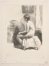 Nude Female Model Sitting in a Room