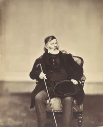 Seated Man with Cane and Hat