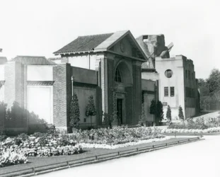 The Reptile House at London Zoo in 1928 with formal flower beds along the paths to the entrance