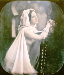 A Woman Kneeling on a Chair Praying