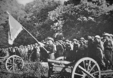 Communist Viet Minh troops on parade with light field artillery, during the siege of Dien Bien Phu, November 1953-May 1954