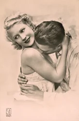 Man Embracing Woman, and Kissing Her Chest