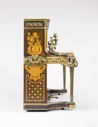 A marquetry and parquetry-inlaid upright piano