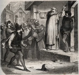 Arnaud du Tilh is attached to a gallows and subjected to the insults of the crowd before his execution for usurping the identity of Martin Guerre. Engraving from 1871 in 