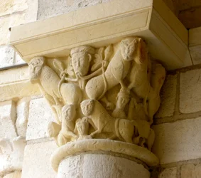 Capital depicting lions and faces