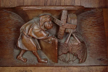 Carving of a miller, from a choir stall