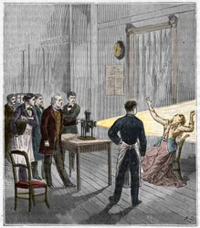 Catalepsy produced under the influence of light - The French neurologist Jean Martin Charcot (1825-1893) studying the phenomenon of hypnosis on a patient at Salpetriere hospital using a magic lantern