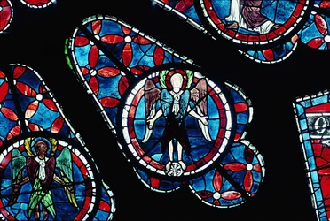 Cherubim on wheel, detail (north rose window)