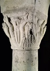 Column capital with a man with raised arms