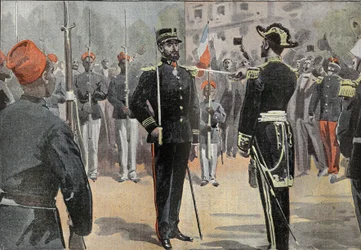 Commander Jean-Baptiste Marchand received the tie of commander of the Legion of Honour, on 30 May 1899 in Toulon, from the hands of Admiral de La Jaille, surrounded by Senegalese riders of the African exploration mission
