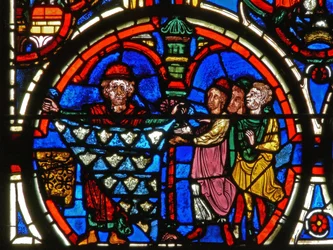 Detail from a window depicting the Passion: donors and the furriers