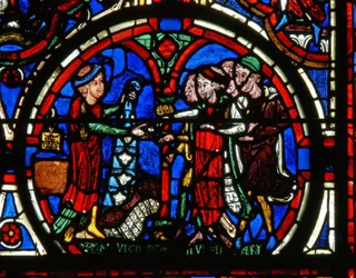 Detail from a window depicting the Passion: donors and the furriers