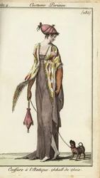 Fashionable woman walking her toy dog