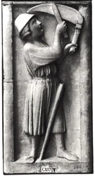 Peasant sharpening his scythe for the haymaking, representing the month of June, from the Portal of the Virgin on the West Facade