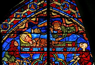 Pilgrims and an angel at the tomb of Thomas Becket
