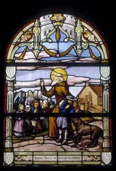 Saint Hervé blessing the faithful - stained glass windows of St Germain church in Kerlaz