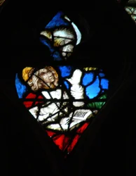 The west rose window depicting a scene from the Book of Revelation: Opening of the fourth seal, with the eagle of St John