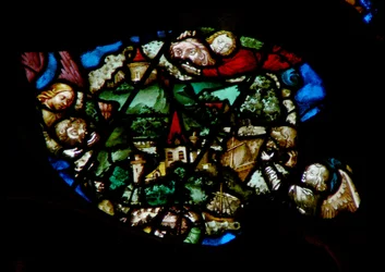 The west rose window depicting a scene from the Book of Revelation: Angels holding back the wind from the land and the ships of the sea