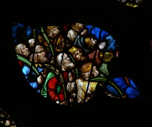 The west rose window depicting a scene from the Book of Revelation: Multitude before the throne of God, in white robes carrying palms