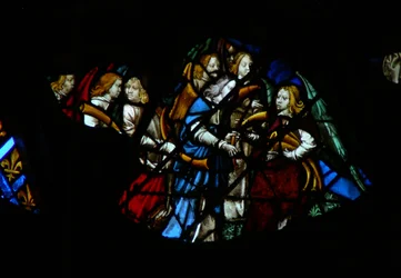 The west rose window depicting a scene from the Book of Revelation: Seven angels before God being given seven trumpets
