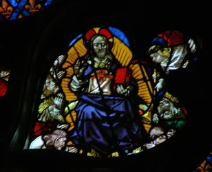 The west rose window depicting a scene from the Book of Revelation: Seventh trumpet; the elders prostrate themselves before the throne