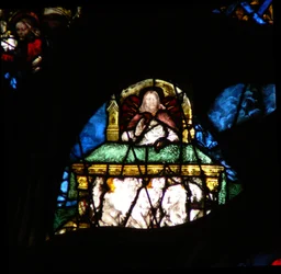 The west rose window depicting a scene from the Book of Revelation: Souls of the martyrs under the altar of Christ