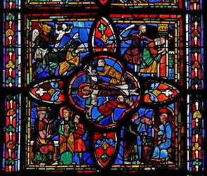 Window depicting the second section of window w7: at the centre is the crucifixion of St Peter; elsewhere is St Peter before Nero; St Peter imprisoned; the devil takes a soul