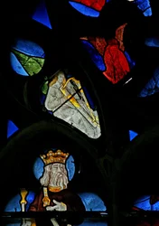 Window depicting a musician angel with a harp