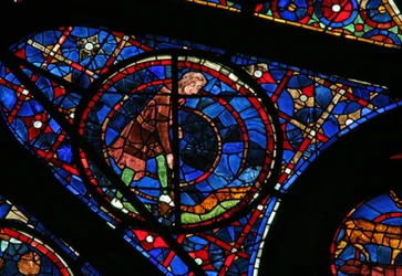 Window w115 depicting Cain cultivates the ground
