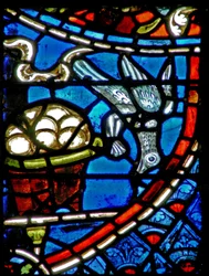 Window w11 depicting a bird comes to eat from the bakers basket